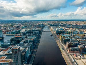 Aerial of Dublin's River Liffey, blue sky summer day